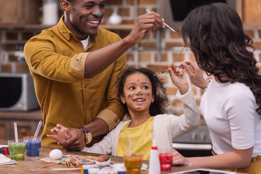 family playing with poster paints