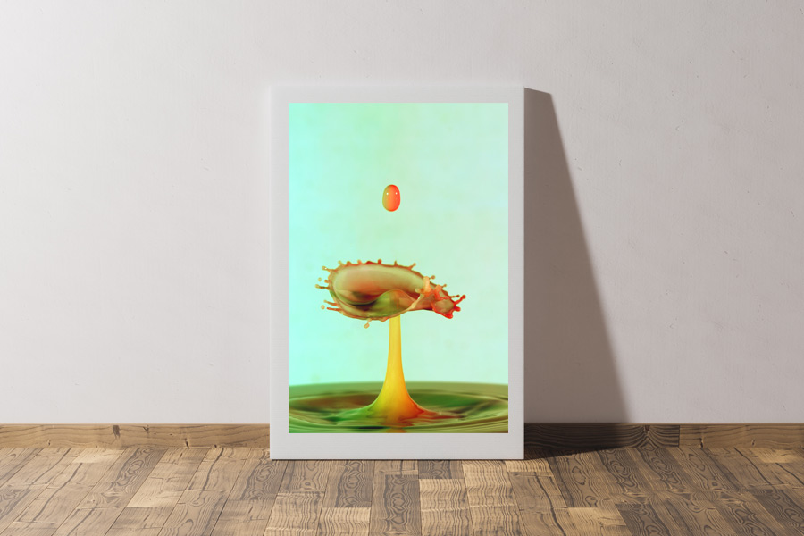image of art canvas leaning against a wall with abstract water drop image on it.