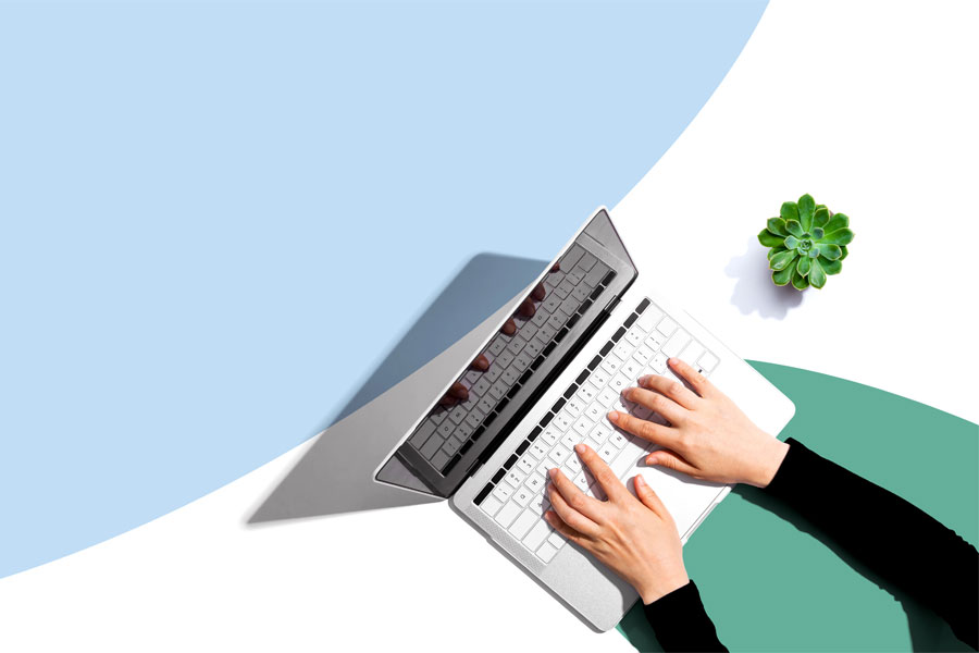 composite image of hands on keyboard of laptop with coloured background