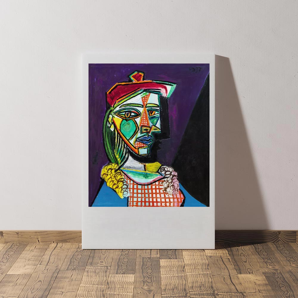 image of art canvas leaning against a wall with Picasso image on it.
